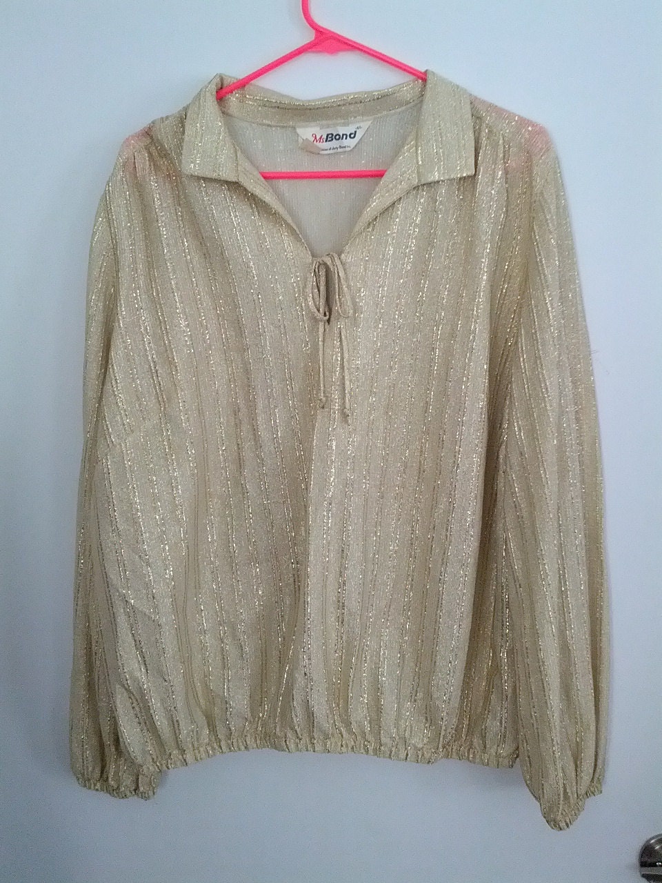 women white and gold shirt