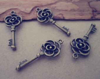 15pcs of Antique Bronze Flower key pendant charm 11mmx25mm