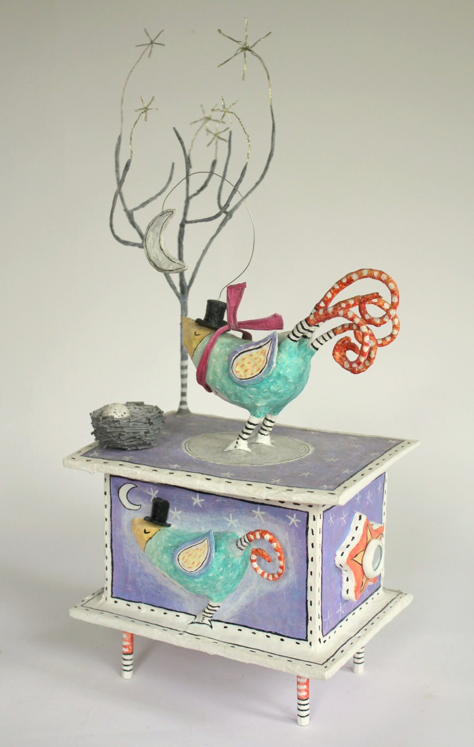 Papier mache box bird sculpture. Bird with warm by