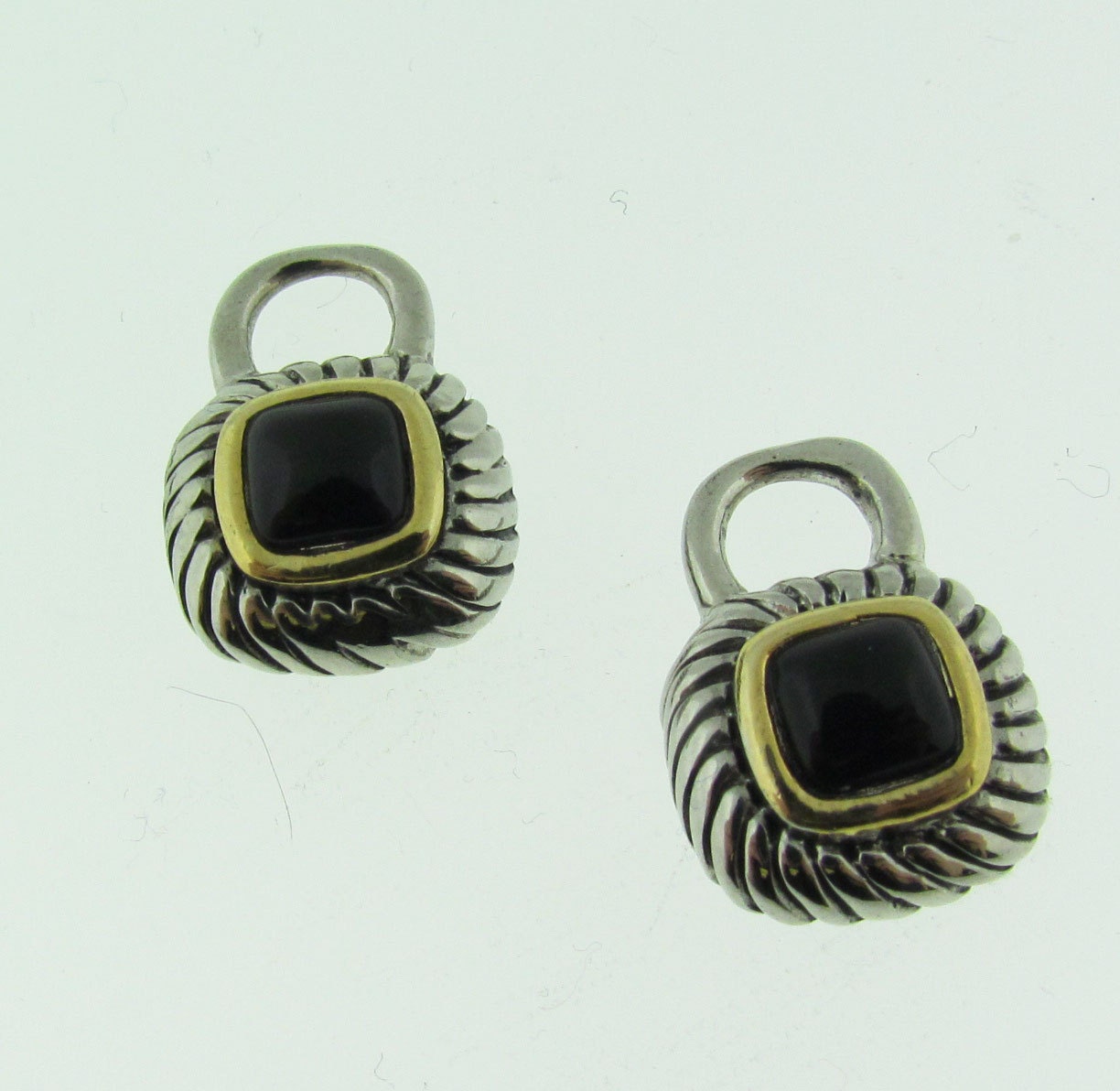 Silver and gold tone earring dangles.