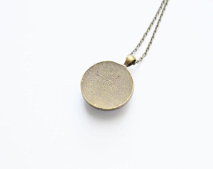 The SPACE Round pendant with the image of the planet Earth from brass and glass retro and vintage