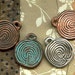 4 Labyrinth Disk Pendants in Metal Finishes - Design is a Maze from a Crete Coin - CLDM4