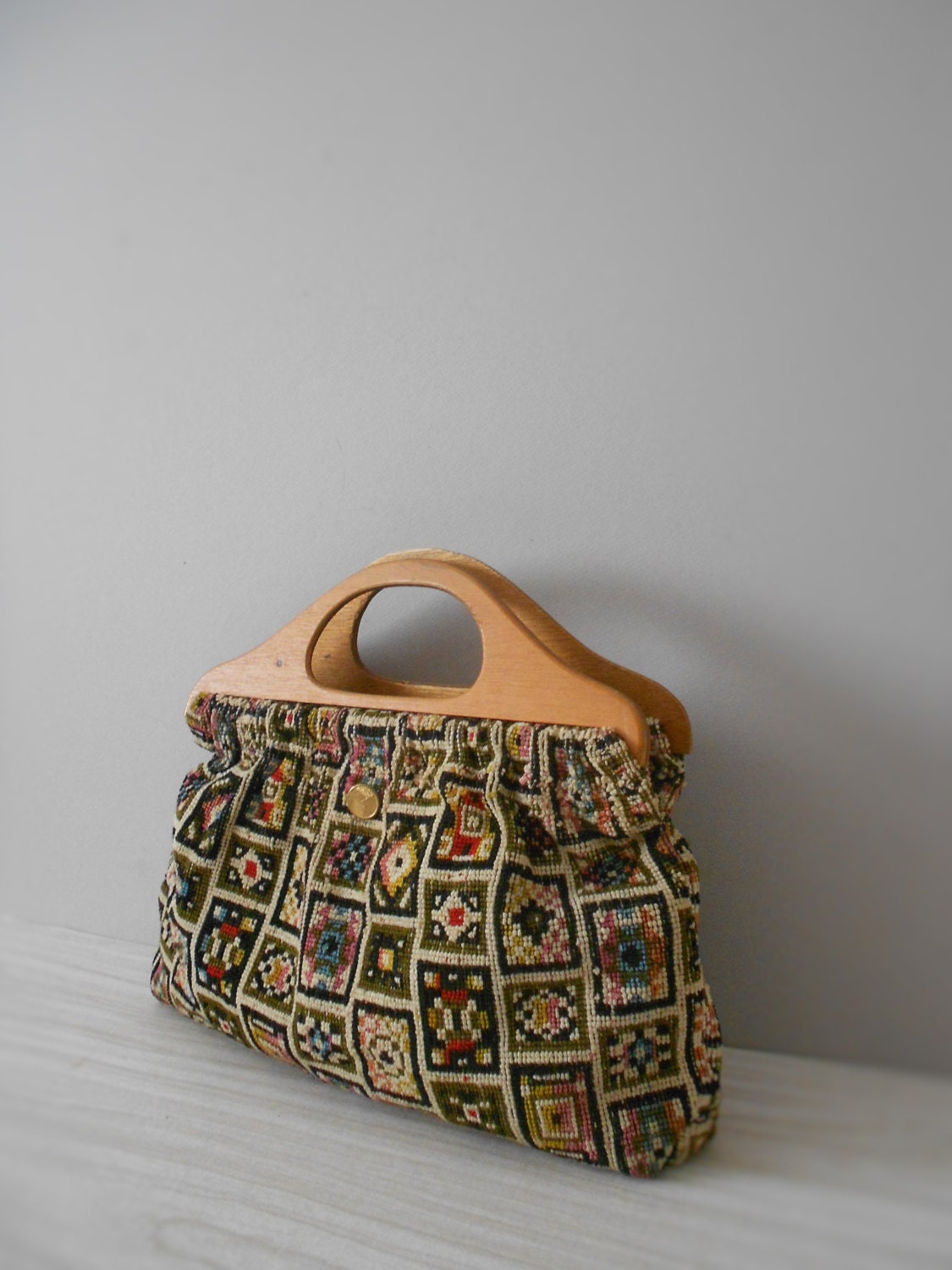 woven brown textile carpet handbag / purse / wooden handle