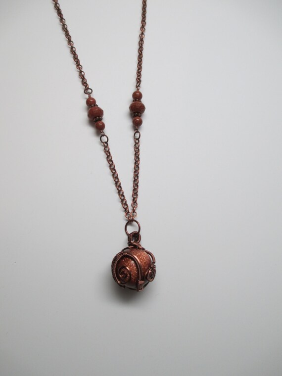 Wire Wrapped Goldstone Orb Necklace in Antique Copper