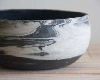 Marbled ceramic bowl in black and white. Handmade ceramic bowl with black glossy glaze