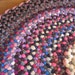 Reserved for Wendy R. Ready To Ship Round Vintage Wool Braided Rug in Fushia, Rumba Red, and Hyacinth Violet with weaving accents