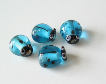 Glass ladybug beads turquoise blue 4 pcs.