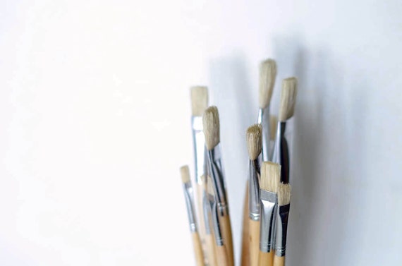 Paint brush set of 12. Flat paint brushes made of stiff hog hair with long wooden handle. Oil painting, mural painting, artist paint brushes