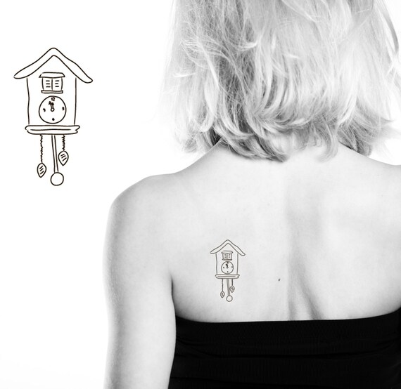 Temporary tattoo with pendulum clock cuckoo clock by Tootytattoos