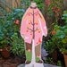 Hand painted wooden sculpture - The Pink Apple Man