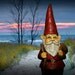 Garden Gnome Itinerate Traveler at the Beach at Sunset on a