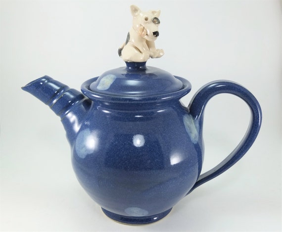 blue teapot with a dog