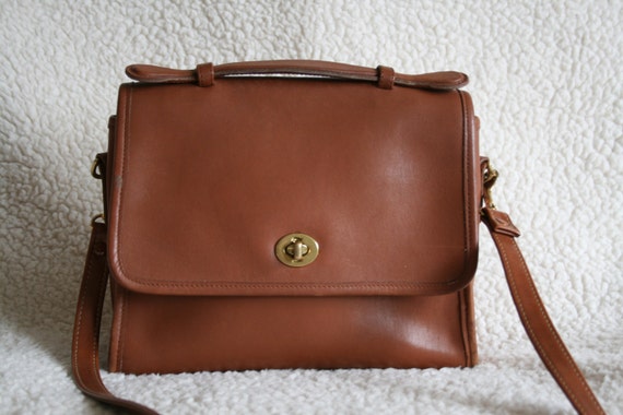 red and beige coach purse