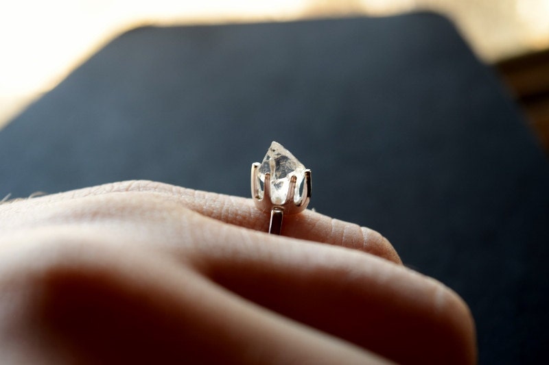 Engagement ring with raw diamond