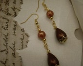 Earrings.Pierced.Dangle.Recrafted vintage beads.Burgundy and goldtone