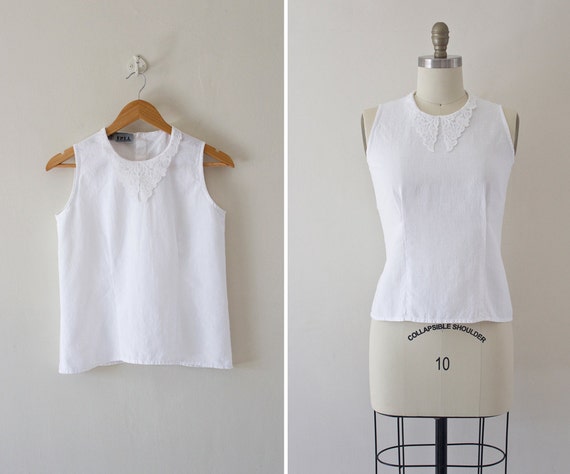 sleeveless white blouse with collar