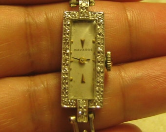 Antique Platinum &14K white gold Diamond watch. weight 14 grams.