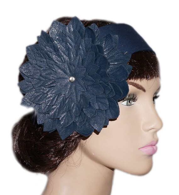 Navy blue headband embellished with a large simile leather flower