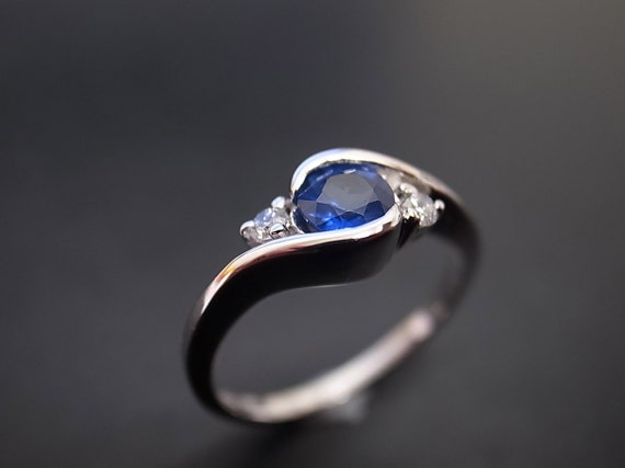 Diamond and Blue Sapphire Engagement Ring in Platinum