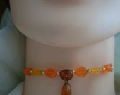 Choker. Recrafted. Vintage drop earring and beads. Orange.