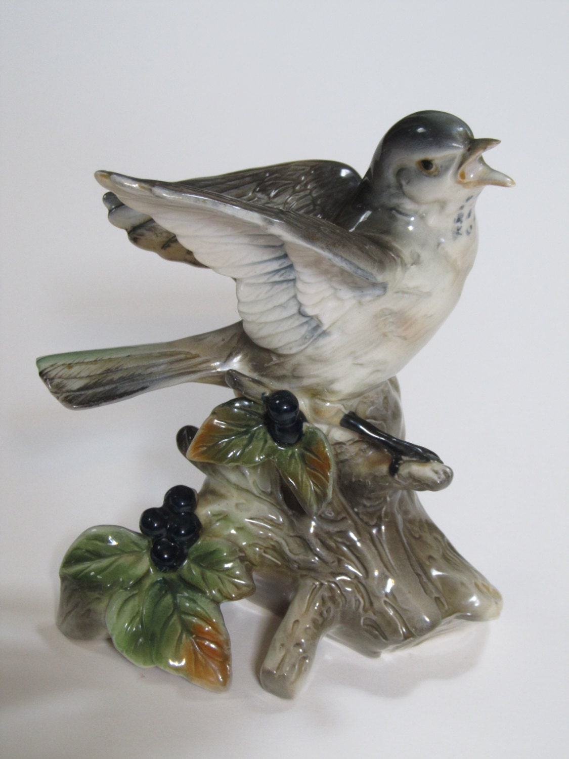 green bird figurine