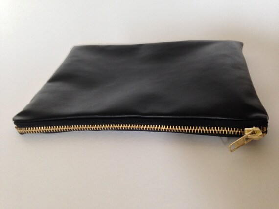 black faux leather clutch bag