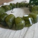 Mossy green Vesuvianite Center Drilled Nuggets - Average 12-14mm, 1/2 strand
