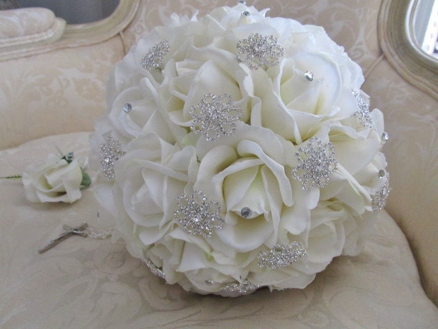 Ivory real touch rose and rhinestone brooch wedding bouquet.