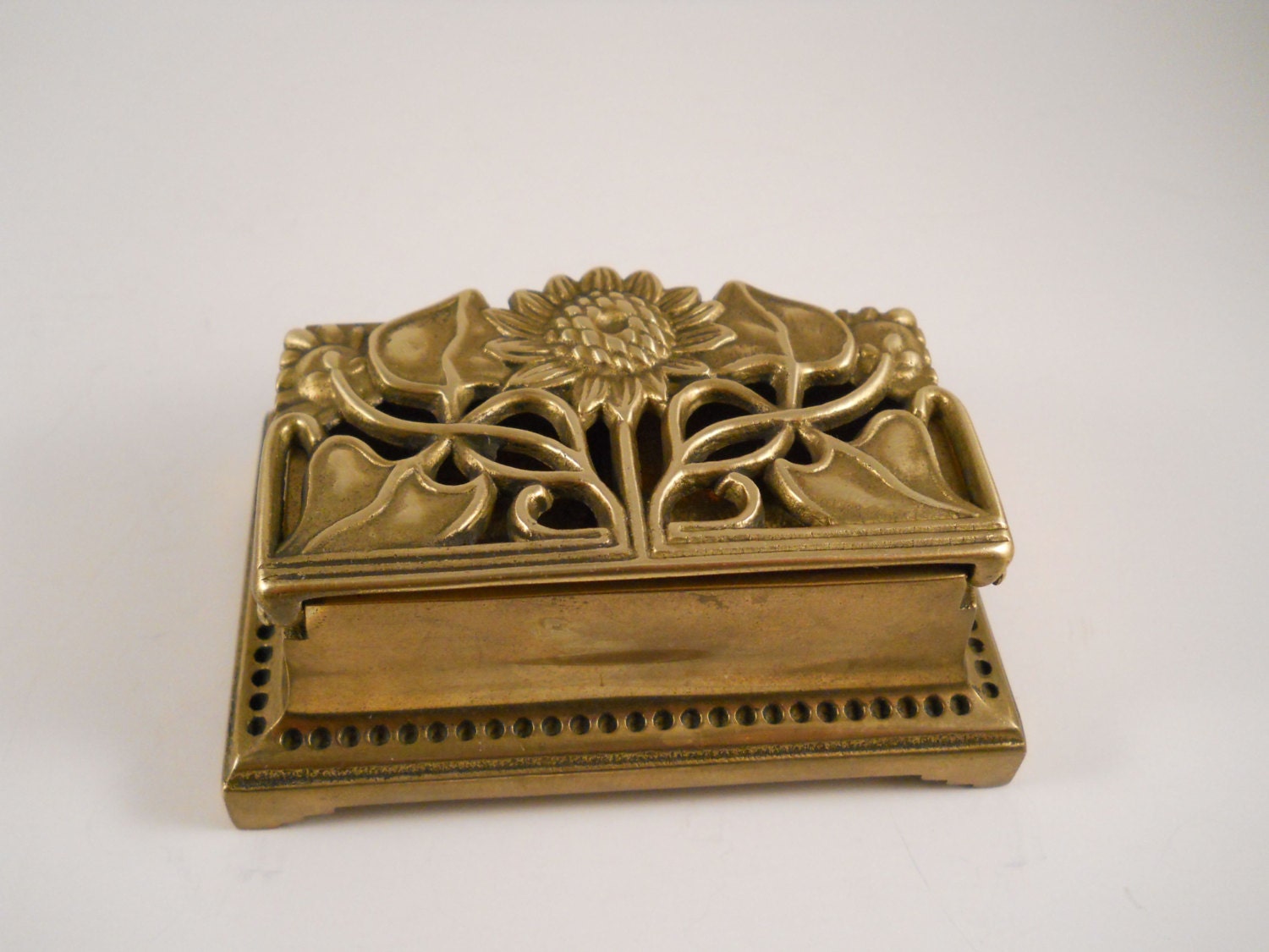 Great Brass Stamp Holder with hinge and flowers on lid desk