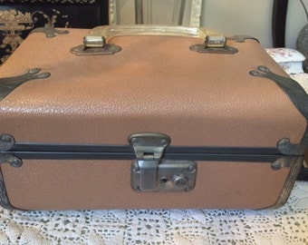 Pink travel-train case with clear handles