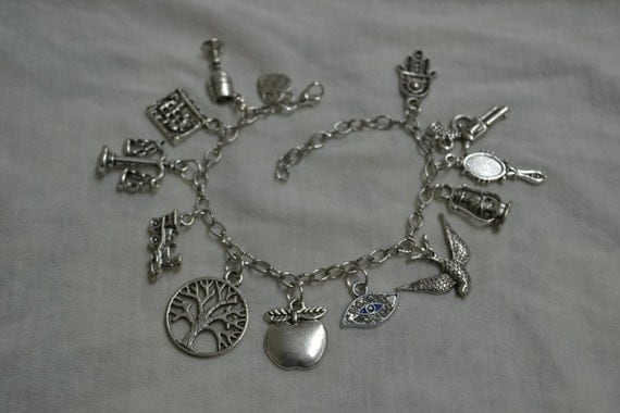 Items similar to Charm bracelet - 12x charms on Etsy