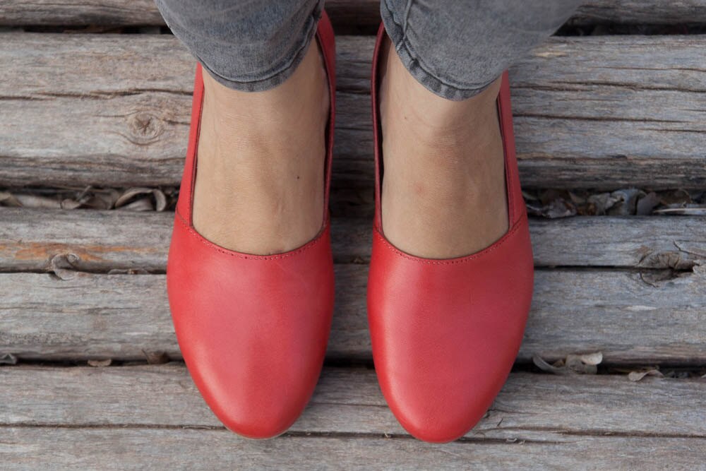 red flat leather shoes