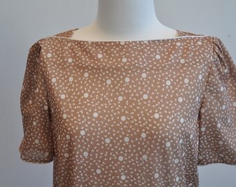 Sweet tan/creme dress with pleated skirt