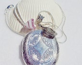 Sale - Oval silver locket necklace, locket with crown charm and heart shaped lampwork bead charm.
