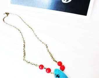 Necklace made with recycled skateboard