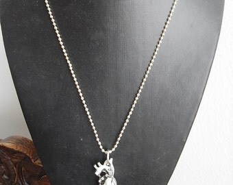 Anatomically correct heart necklace, long chain.