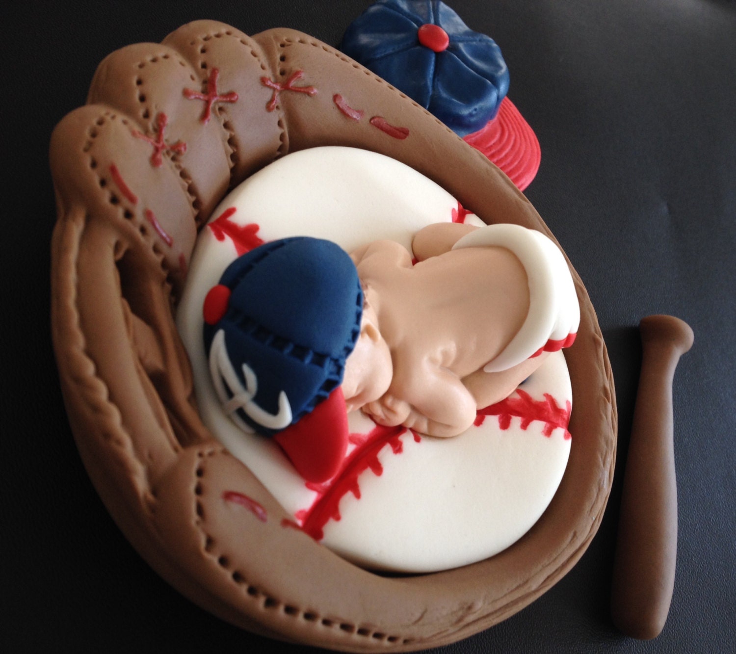 Fondant baby boy baseball inside a 3D glove cake topper in