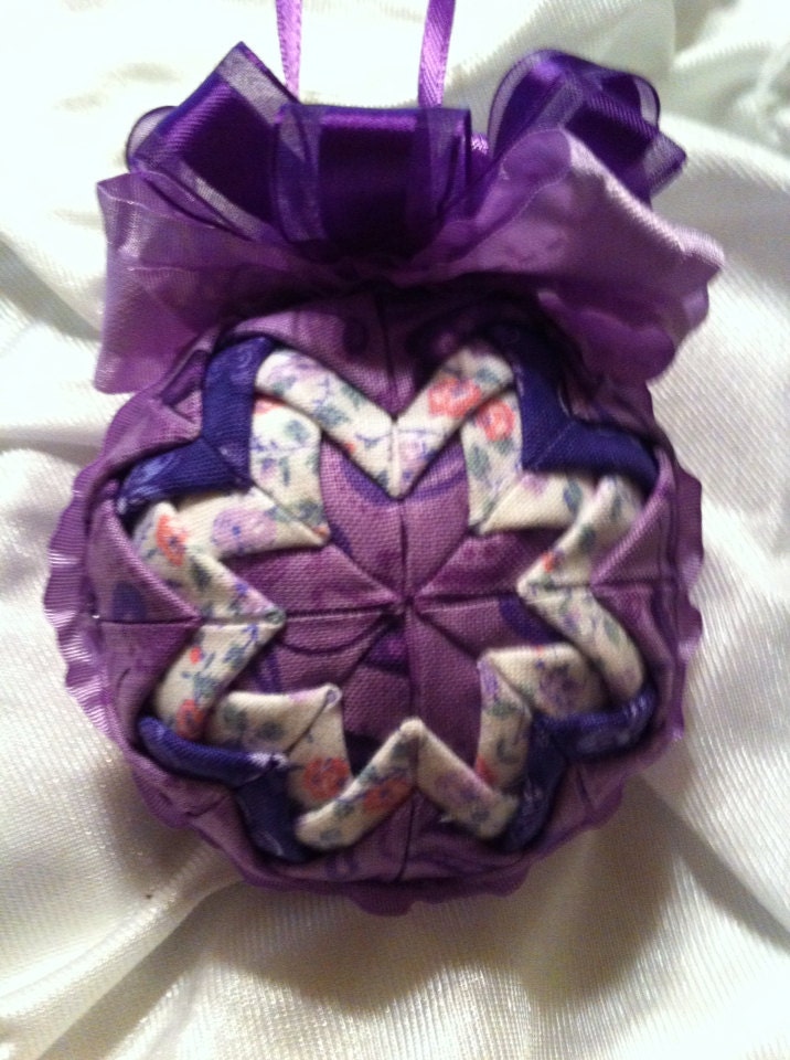 Purple printed fabrics folded star ball decoration.