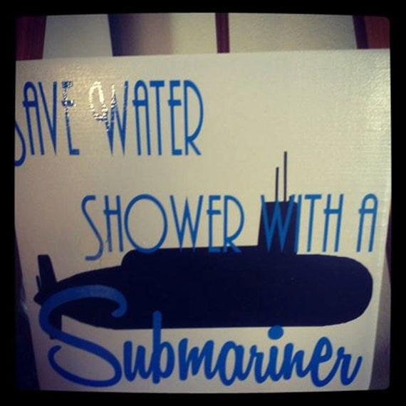 Save Water shower with a Submariner wood and vinyl sign