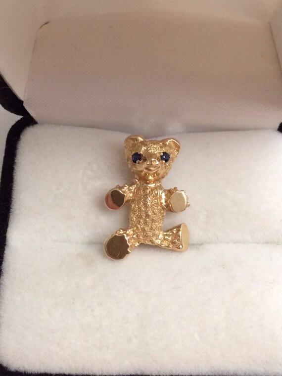 black and gold teddy bear