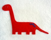 Stretch the felt dinosaur. Fun nursery picture with a dinosaur theme.