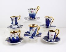 vintage miniature tea cups and saucers