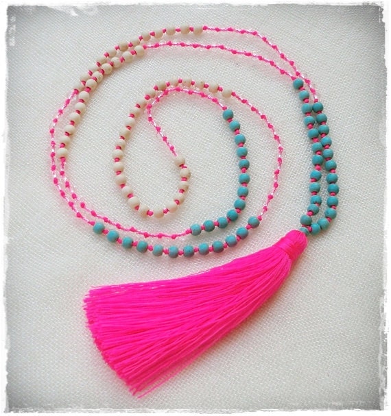 Neon pink tassel necklace with turquoise cream and clear