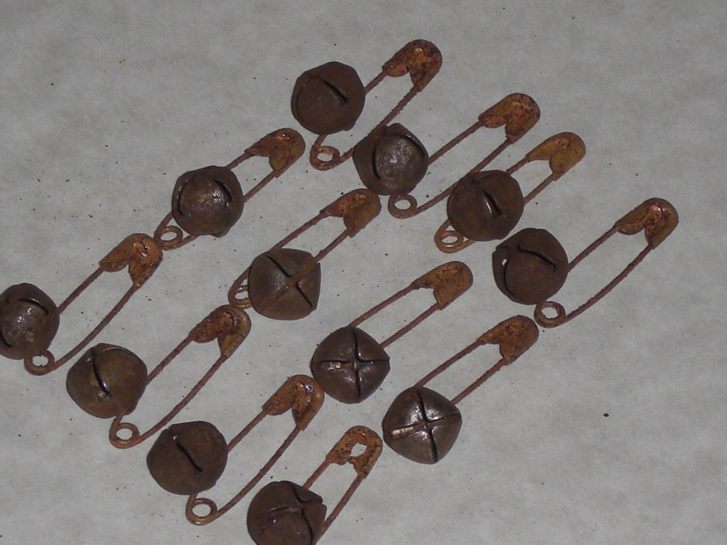 12 Primitive Safety Pins and 12 Rusty Jingle Bells 10mm