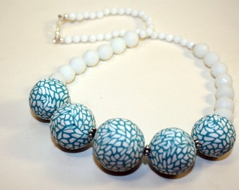 Lovely hollow bead necklace in polymer clay .