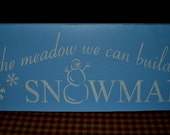 in the meadow we can build a SNOWMAN primitive wood sign