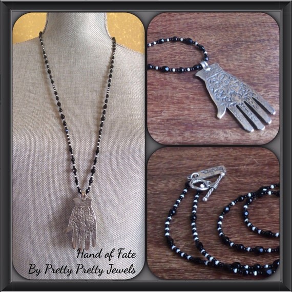 Items similar to Hand of Fate Necklace on Etsy
