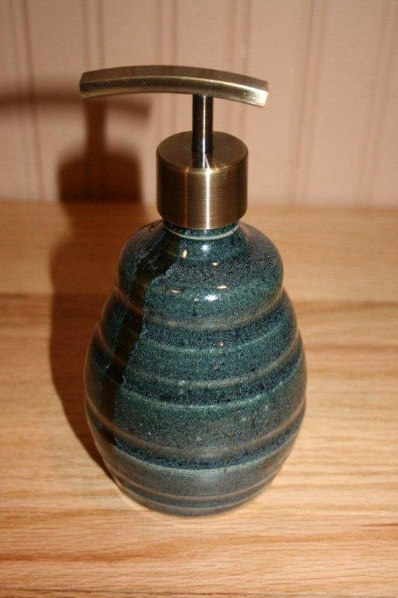 Handmade blue green pottery soap or lotion dispenser in