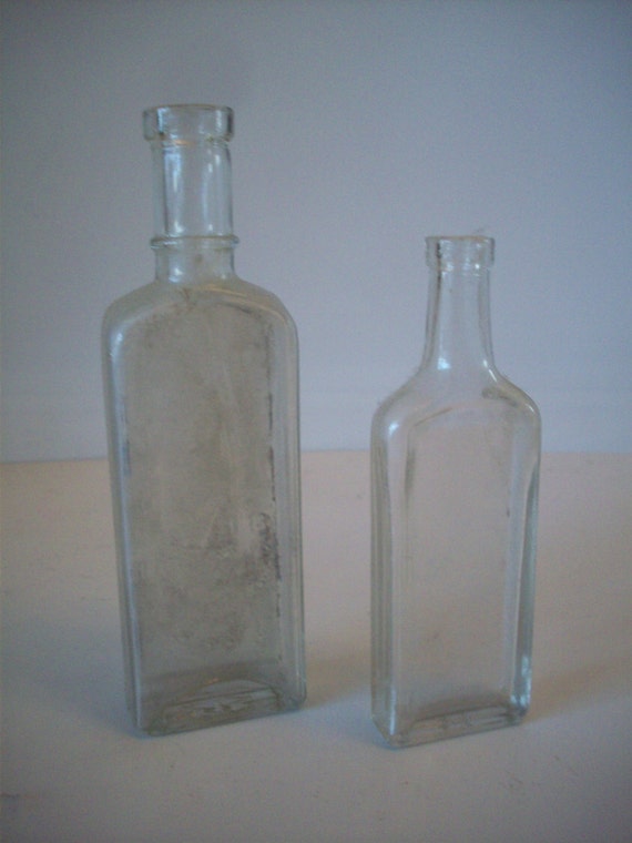 Download Two Thin Vintage Clear Glass Bottles
