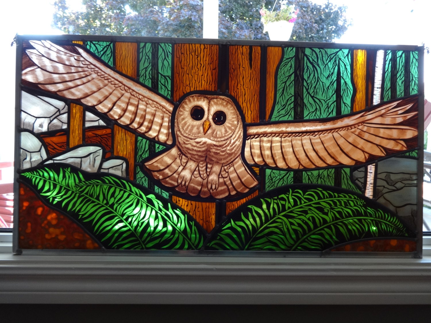 Owl in flight painted stained glass panel